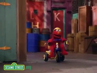 Sesame Street: Elmo Riding A Tricycle
