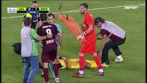 An injured player in Greece receives hilariously bad treatment as he's stretchered off the pitch