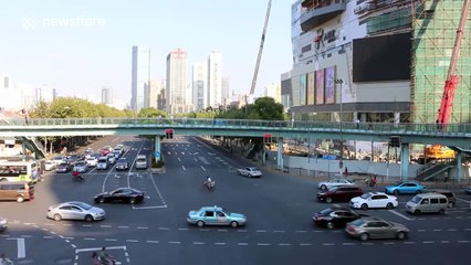 Giant Ferris wheel installed on building roof in Shanghai