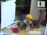 Baby boy wears yellow bowl helmet