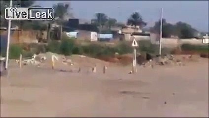 Iraqi soldiers are somewhat startled by an RPG attack on their vehicle