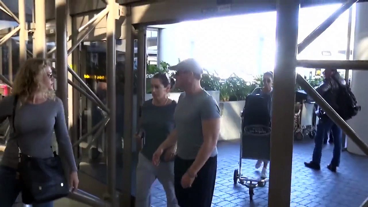X17 EXCLUSIVE - Jean-Claude Van Damme Catches Flight At LAX With Wife Gladys Portugues