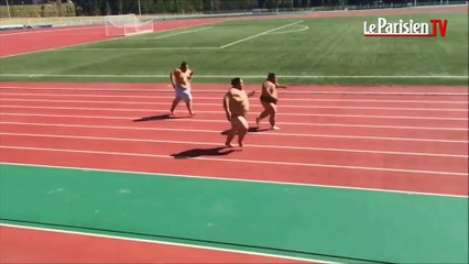 Japon : des lutteurs de sumo font un sprint sur une piste