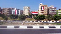 مواطنون يرفعون اعلام مصر فوق منازلهم أحتفالا بقناة السويس الجديدة يوليو2015