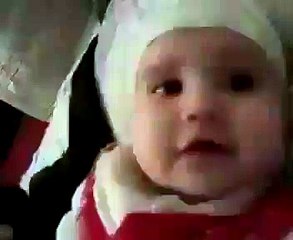 a too little baby reciting Kalma Tayyaba