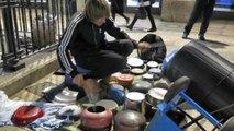 London Street Drummer Plays a Big Drums all Made of Pots and Pans. Seen in Oxford Circus