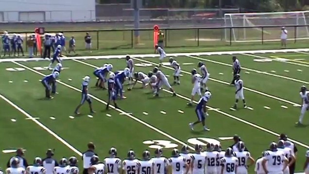 Fairmont Senior High (WV) sophomore Bryson Gilbert hurdles two defenders on his way to the end zone