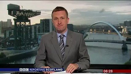 Giant spider photobombs BBC news broadcast