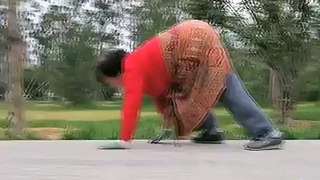 Chinese fitness fanatics CRAWL on their hands and feet for morning exercise .