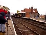 Trainspotter leans a bit too far over the tracks...