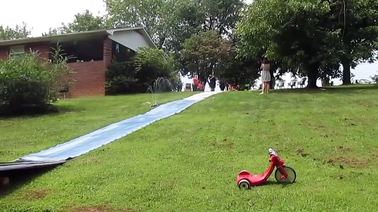 Girl Gains Too Much Speed On Slip-N-Slide