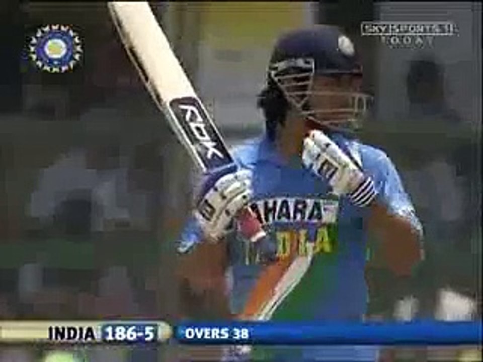 Dhoni plays with ice bags on his back,Jamsedpur 2006. -