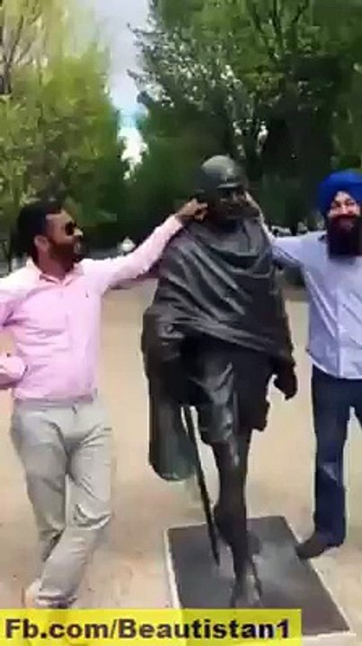 Hitting Gandi by a sing