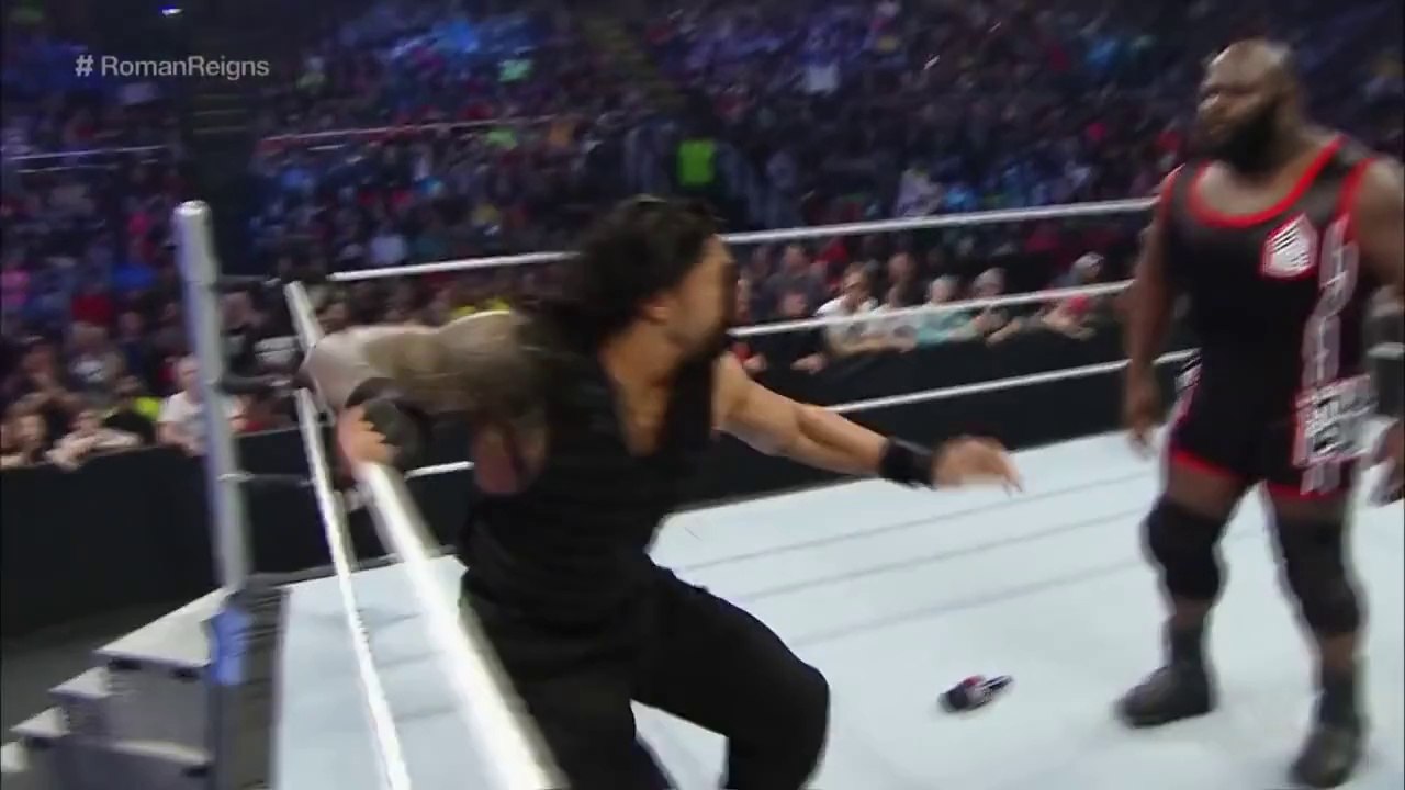 Roman Reigns spears a returning Mark Henry through the barricade SmackDown, March 12, 2015