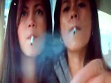 2 cute asian girls smoke