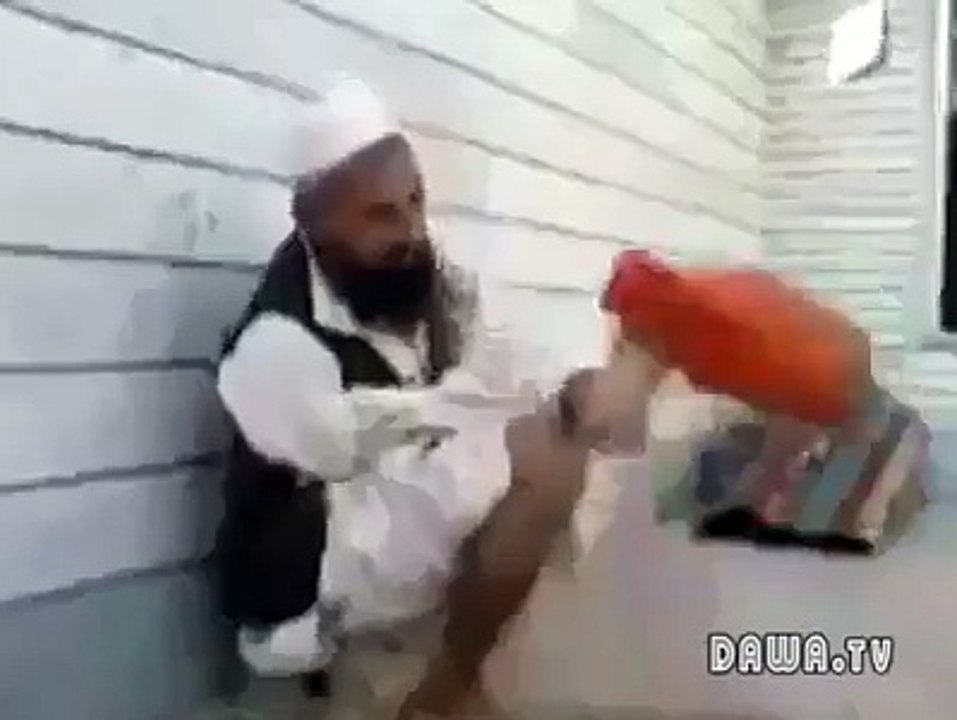person wdout hand performing ablution