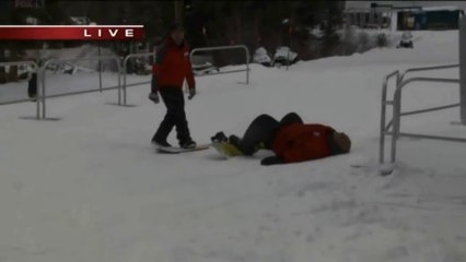 Reporter falls trying to high five on a Snowboard live on Tv!