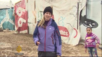 Syrian refugees burn plastics to stay warm