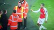 Theo Walcott gets a fan on the pitch for a bump  then gives him his shirt Pure class