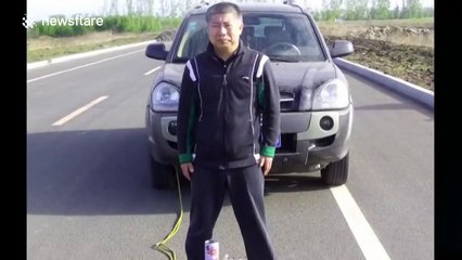 Kung fu doctor uses one hand to pull a car