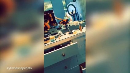 Kylie Jenner shows off her toned stomach in black crop top