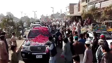 PTI rally showered with flowers wherever it goes