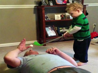 Kid Fails To Hit Golf Ball Out Dad&#39;s Mouth