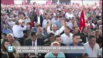 Divided Turkey votes in critical election as violence spirals