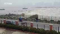 Footage- Visitors washed away by strong Qiantang tidal bore