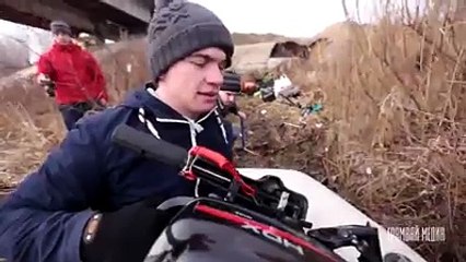 An unusual place for a barbecue  guys board a piece of ice floating down a river and hold a cook out