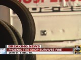 Phoenix tire shop survives fire