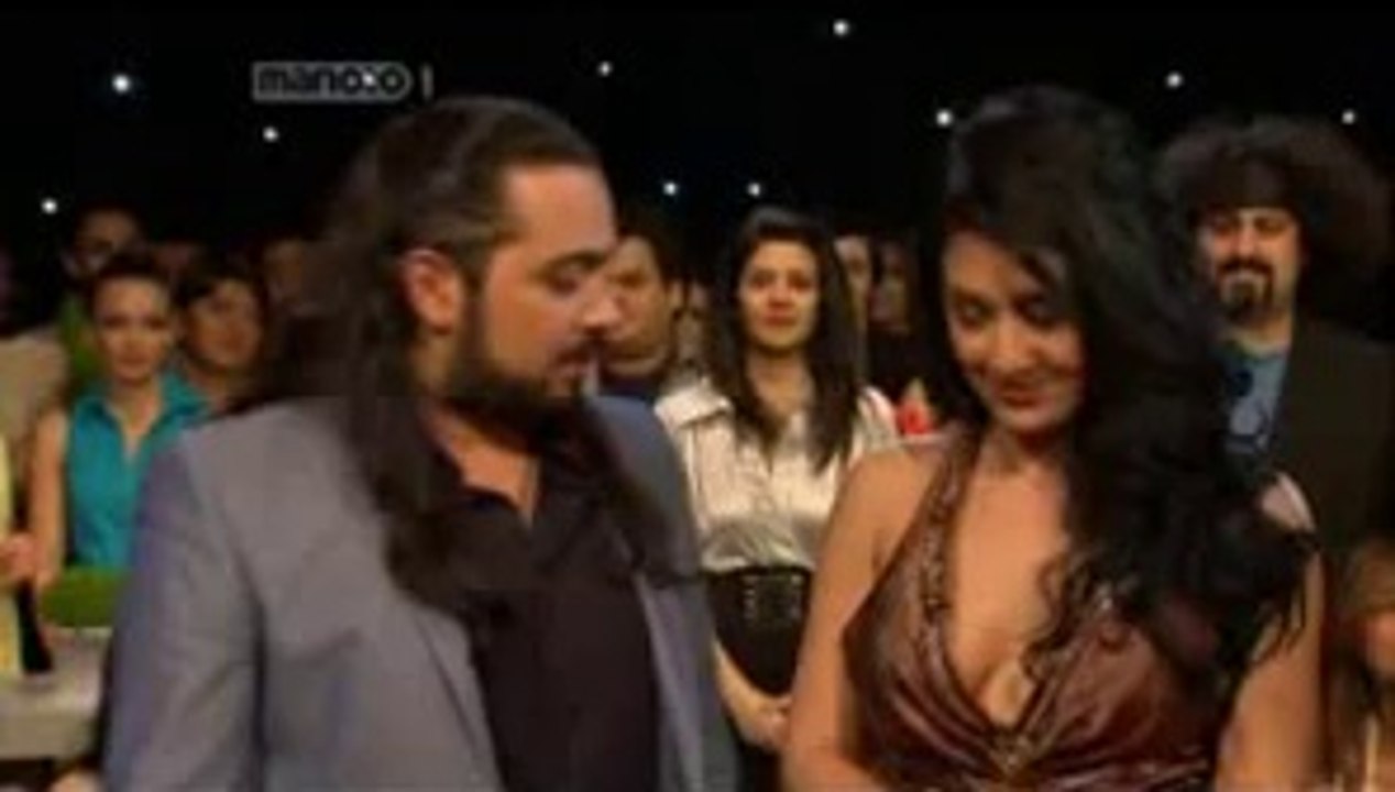 Iranian TV Presenter Staring at Participant's