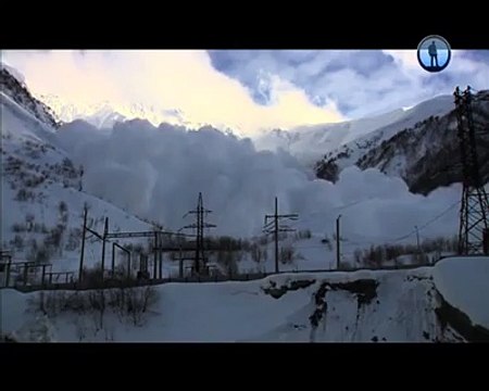 Russian camera man gets chased (and buried) by an avalanche.
