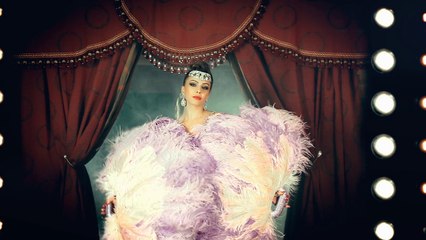 Burlesque dance with feathers by Baby Doll show