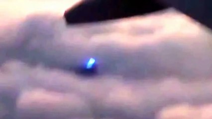 UFO FLYING BEHIND THE PLANE!