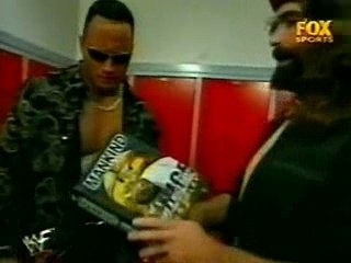 foley gives the rock a copy of his book