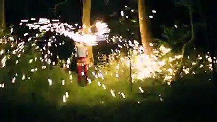 Girl spinning hot metal, played back in reverse. Mesmerising effect.