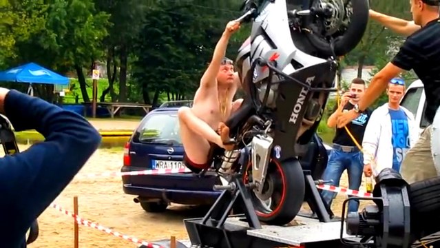 Drunk Guy Tries Out The Motorcycle Wheelie Machine