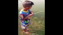 LiveLeak - Boy catches fish with a toy fishing pole