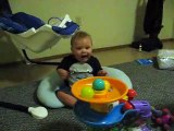 Adorable baby Boy Amazed By New Toy