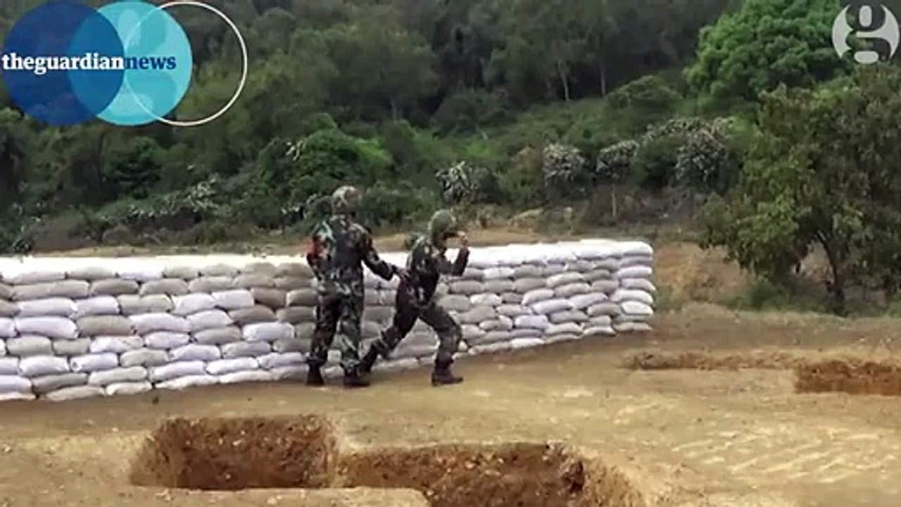 A Chinese army recruit drops a live grenade during training