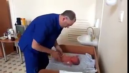 doctor checking out baby