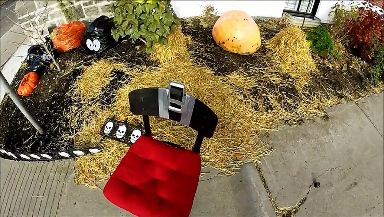 Smashing pumpkins - Man launches giant pumpkin off roof to smash even larger one
