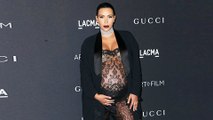 Kim Kardashian FLAUNTS Baby Bump In Black Sheer Jumpsuit At LACMA
