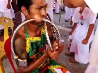 Vegetarian festival- Painful rituals forcing knives through own cheeks