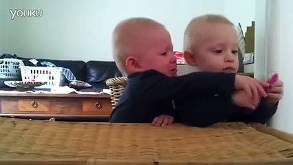 Twin baby fighting over tooth brush   Very cute