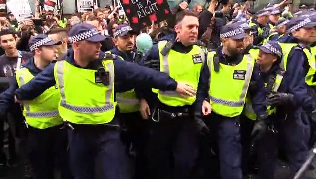 Students protest the government over tuition fees in London