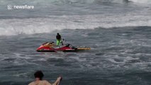 Wave gets the better of jet ski riders