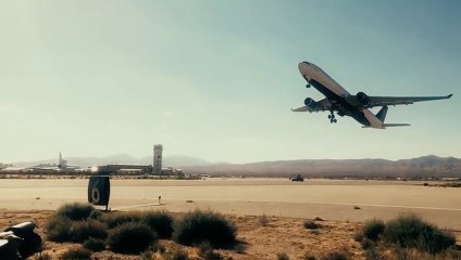 Slow motion of a Delta jet taking off over a speeding car