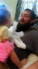 Dad surprised little girl with a peek-a-boo